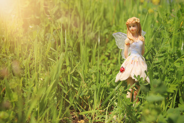 Fototapeta na wymiar image of magical little fairy in the forest.