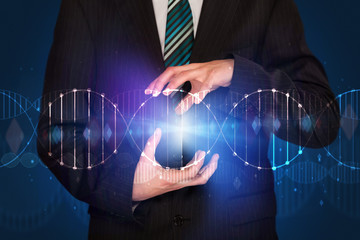 Businessman holding DNA