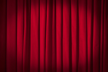 Red curtain theater background with folds, shadows and highlights.