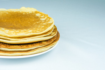 stack of pancakes on a white plate selective focus, white background, With copy space