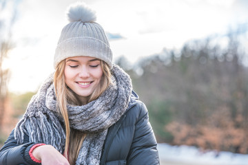 Young pretty woman in winter snow