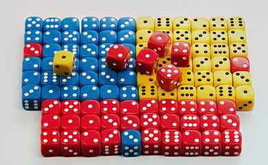 Colorful dice arranged in a patter with some random
