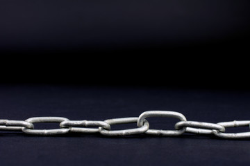 chain on a black background close-up of a selective focus