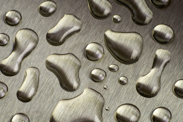 Drops of water on metal. Closeup. Beautiful texture and gray background.