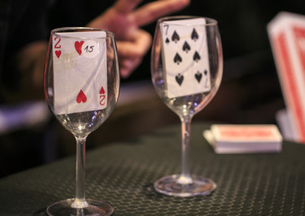 poker playing card inside a glass cup