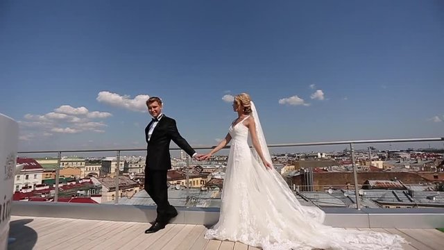 Bride and groom at the roof in the city