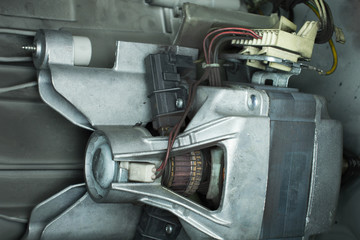 repair of the electric motor of the washing machine, replacement of brushes, home appliances repair & services concept