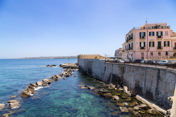 Fototapeta na wymiar Syracuse, Italy. Embankment on the island of Ortygia and the medieval bastion