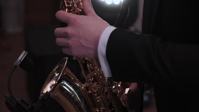 Saxophonist at the party playing music