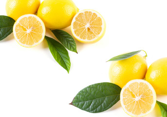 Lemons with leaves on a white background. Fresh lemons on a white background.