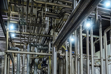 Industrial pipeline system in brewery for ingredient transportation. Abstract industrial pipeline background