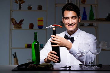 Professional sommelier tasting wine in restaurant