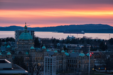 A colorful sundown over downtown Victoria, BC with buildings and a colorful sky