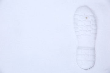Footprints of shoes on fresh snow.