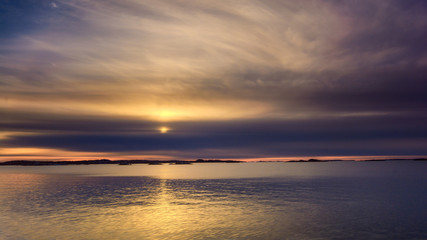 Fototapeta na wymiar Setting sun glowing with beautiful colors,Saltholmen, Gothenburg, Sweden 
