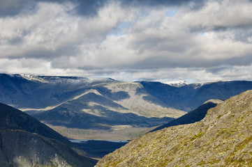 Khibiny Mountains, Kola Peninsula, Russia. Behind the Polar Circle. Some snow on mountains` tops.