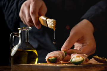 Cooking spicy peppers with cheese and meat bacon. Food recipe on wooden background.