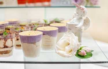 Desserts on a glass stand. Concept party, wedding, restaurant, catering, dessert.