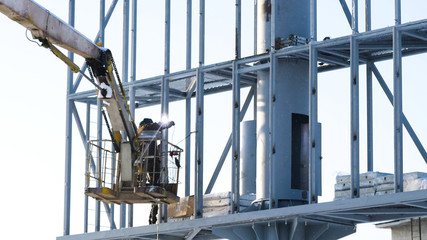 Steel structure for an advertising banner on the wall. construction site and blank billboard and...