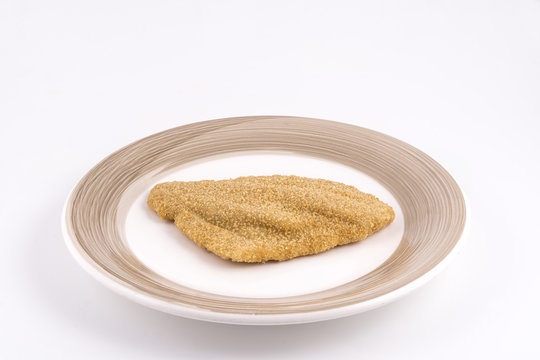 a fillet of plaice breaded frozen on the plate