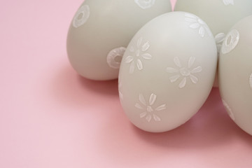handmade easter eggs isolated on a pink background.