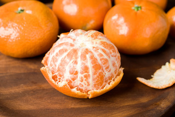 peeled tangerines on classic rustic wood