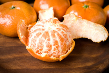 peeled tangerines on classic rustic wood