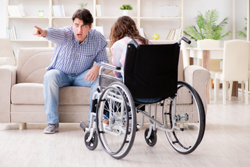 Fototapeta na wymiar Desperate disabled person on wheelchair
