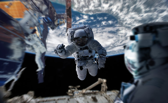 Astronaut working on a space station 3D rendering elements of this image furnished by NASA