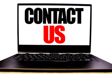 Handwritten text showing Contact Us. Business concept writing for Customer Support Written on monitor front screen, white background with space office view.