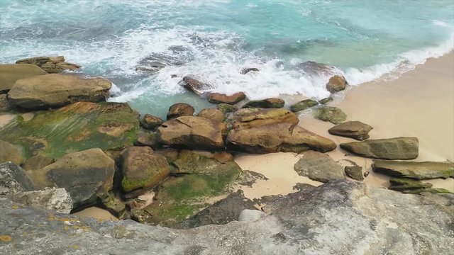 View of waves hitting the coast , near tamarama beach, on a sunny summer day, in Sydney, Australia