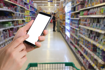 human hand hold and touch smart phone, tablet, cellphone with white blank screen on products shelf...