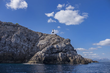 Fototapeta na wymiar Lighthouse along the coastal area of Alcudia, Mallorca, Spain