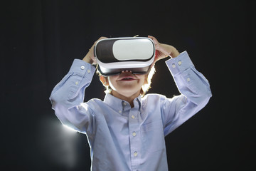 Boy enjoying his 3D virtual reality glasses at school