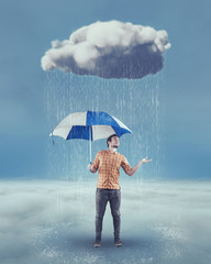 Young man holding an umbrella