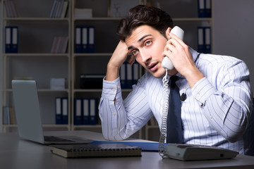 Tired and exhausted helpdesk operator during night shift