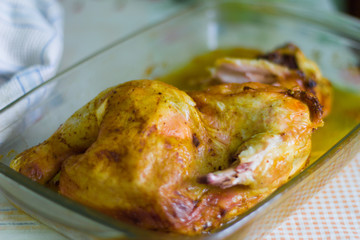 fried half chicken in brine in a pan