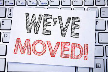 Handwritten text caption showing We Have Moved. Business concept writing for Company Changing Place written on sticky note paper on the white keyboard background.