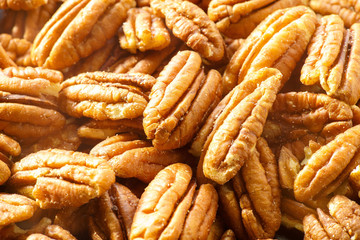 Pecans nuts. A close-up photograph. Unrefined whole kernel