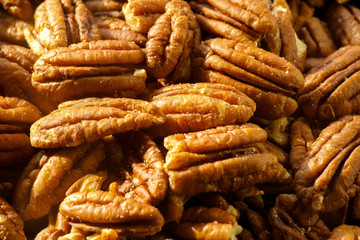 Pecans nuts. A close-up photograph. Unrefined whole kernel