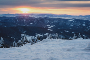 Obraz premium sunrise in snowy mountains