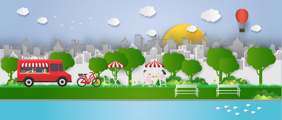 Creative ideas of Food Truck with opened street and fast food, truck with table.  Festival, Picnic, Cafe in public park.Outdoor recreation. paper art and digital craft style. vector Illustration © Small Smiles_dimple