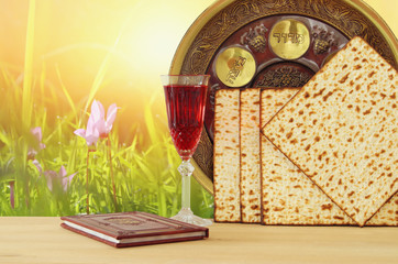 Pesah celebration concept (jewish Passover holiday). Traditional book with text in hebrew: Passover Haggadah (Passover Tale).