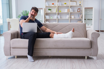 Man with broken leg recovering at home