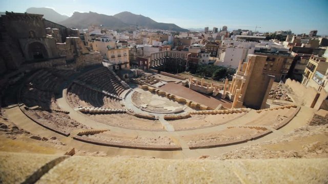 A slow pan of the famous Amphitheater Romano inside, Cartagena, Spain.