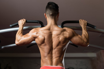 Bodybuilder Doing Pull Ups Best Back Exercises