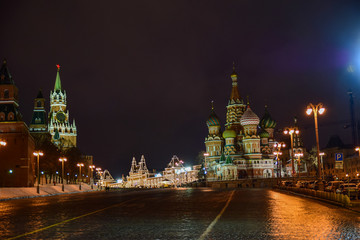 View of the Red square and the Cathedral at night and in the evening in winter