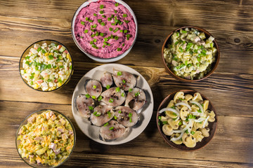 Various festive dishes on wooden table