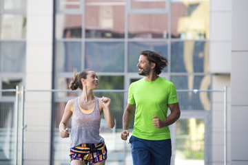 Couple running in urban enviroment