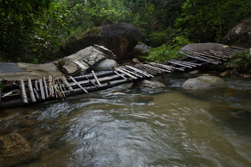 Wood bridge across the waterfall in the rainforest - 193769966